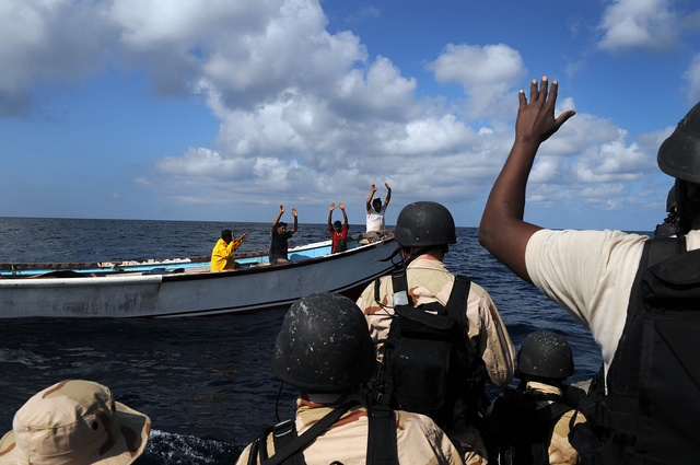 USS Anzio crew members board vessel